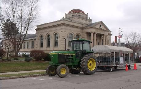 [photo: library building with tractor, 2022]