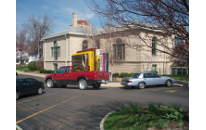 [faked photo of a pickup truck with a stack of enormous books in the back]